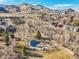 Aerial view of the neighborhood with a playground, park and mountain views at 514 Creekside Ct, Golden, CO 80403