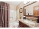 Bathroom featuring granite countertops, a shower, and updated fixtures at 514 Creekside Ct, Golden, CO 80403