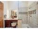 Bathroom vanity, glass shower, and lighted makeup mirror at 514 Creekside Ct, Golden, CO 80403