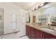 Bright bathroom with dual sinks, granite counters, a glass shower, and a well-lit vanity area at 514 Creekside Ct, Golden, CO 80403