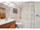 Cozy bathroom features a tub-shower combination and a vanity with a sleek countertop at 514 Creekside Ct, Golden, CO 80403