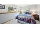 Comfortable bedroom with natural light, a window view, and a soft, colorful comforter at 514 Creekside Ct, Golden, CO 80403