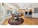 Eat-in kitchen with hardwood floors, a round dining table, and counter seating under multiple skylights at 514 Creekside Ct, Golden, CO 80403