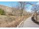 Scenic view of the property backing onto walking path with lovely mountain views at 514 Creekside Ct, Golden, CO 80403