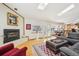 Open floor plan with fireplace, skylights, hardwood floors, living and dining areas, and kitchen access at 514 Creekside Ct, Golden, CO 80403