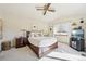 Comfortable main bedroom with vaulted ceiling, ceiling fan, and view of the backyard at 514 Creekside Ct, Golden, CO 80403