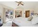 Bright main bedroom with vaulted ceiling, ceiling fan, and access to an outdoor deck at 514 Creekside Ct, Golden, CO 80403