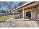 A covered outdoor patio with a stone retaining wall at 514 Creekside Ct, Golden, CO 80403