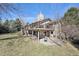 Rear exterior features a tiered deck, patio and fenced yard at 514 Creekside Ct, Golden, CO 80403