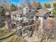 Rear exterior showcasing a multi-tiered deck and patio at 514 Creekside Ct, Golden, CO 80403