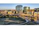 An elevated view displays Denver's skyline adjacent to a lovely park, blending city and nature at 1700 Bassett St # 504, Denver, CO 80202