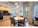 Bright dining area features wood floors, modern lighting, and a sliding door to the outside at 1700 Bassett St # 504, Denver, CO 80202