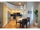 Modern kitchen features stainless steel appliances, sleek black backsplash, and a cozy dining area, great for entertaining at 1700 Bassett St # 504, Denver, CO 80202