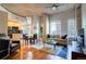 Open-concept living area with modern decor, hardwood floors, and abundant natural light, perfect for relaxation at 1700 Bassett St # 504, Denver, CO 80202