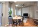 Inviting living area with a modern ceiling fan, hardwood floors, and natural light, creating a comfortable ambiance at 1700 Bassett St # 504, Denver, CO 80202
