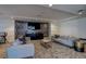 Comfortable living room with elegant wallpaper accent wall and plush seating at 1700 Bassett St # 504, Denver, CO 80202