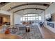 Bright living room featuring a modern fireplace, stylish furniture, and expansive windows with city views at 1700 Bassett St # 504, Denver, CO 80202