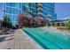 Outdoor pool with lounge chairs and landscaping, with building in the background at 1700 Bassett St # 504, Denver, CO 80202