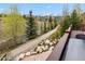 Relax on the deck with mountain views and path access along the stream at 200 Rachel Ln, Breckenridge, CO 80424