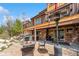 Cozy backyard with a stone patio, fire pit, hot tub, and a heater, perfect for outdoor relaxation at 200 Rachel Ln, Breckenridge, CO 80424