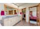 Bathroom with dual sinks, framed mirrors, and access to the bedroom at 200 Rachel Ln, Breckenridge, CO 80424