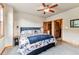 Comfortable bedroom with a ceiling fan, natural light, and mountain views through the window at 200 Rachel Ln, Breckenridge, CO 80424
