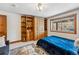 Serene bedroom with blue accents, wood built-ins, and a plush bed for restful nights and relaxation at 200 Rachel Ln, Breckenridge, CO 80424