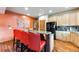The kitchen features wood cabinets, a granite-topped island, and red leather bar seating at 200 Rachel Ln, Breckenridge, CO 80424
