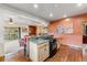 Open kitchen design with wooden cabinets, granite counters, bar seating, and hardwood floors at 200 Rachel Ln, Breckenridge, CO 80424