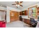 Home office with custom wood cabinets, built-in desk, and bright windows overlooking a natural area at 200 Rachel Ln, Breckenridge, CO 80424