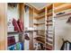 Spacious walk-in closet with custom shelving, hanging rods, and ample storage for clothing and accessories at 200 Rachel Ln, Breckenridge, CO 80424