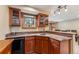 A charming wet bar features wood cabinetry, granite counters, a mini fridge, and a window view of the outdoors at 200 Rachel Ln, Breckenridge, CO 80424