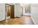 Bedroom with laminate floors, closet, and natural light at 10469 Christopher Dr, Conifer, CO 80433