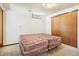 Bedroom with a double bed, carpeted floor, and closet at 10469 Christopher Dr, Conifer, CO 80433