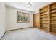 Bedroom with a large window, built in bookshelf, and closet at 10469 Christopher Dr, Conifer, CO 80433