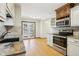 Cozy kitchen featuring granite countertops, stainless steel appliances, and hardwood floors at 10469 Christopher Dr, Conifer, CO 80433