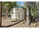A backyard outbuilding for storage surrounded by a forest at 10469 Christopher Dr, Conifer, CO 80433