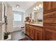 Clean bathroom with shower/tub combo and updated wood cabinets at 831 Crescent Dr, Boulder, CO 80303