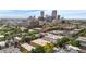 Aerial view showcasing surrounding neighborhood, with city skyline in the background at 1243 N Washington St # 308, Denver, CO 80203