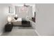 Bright bedroom with neutral carpet, comfortable bed, and modern furnishings at 1243 N Washington St # 308, Denver, CO 80203