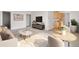 Cozy living room with a view of an adjacent kitchen and dining area, with neutral decor and natural light at 1243 N Washington St # 308, Denver, CO 80203