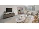 Bright living room featuring neutral decor, large windows, and comfortable seating area at 1243 N Washington St # 308, Denver, CO 80203