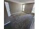 Generous bedroom with neutral walls and carpet, offering plenty of natural light from multiple windows at 2746 S Kenton Ct, Aurora, CO 80014