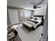Staged bedroom features a neutral color scheme, creating a serene and inviting atmosphere at 2746 S Kenton Ct, Aurora, CO 80014