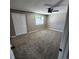 Spacious bedroom featuring neutral walls, cozy carpeting, and a ceiling fan for added comfort at 2746 S Kenton Ct, Aurora, CO 80014