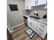 Updated kitchen features stainless steel appliances, modern white cabinets and granite countertops at 2746 S Kenton Ct, Aurora, CO 80014