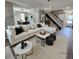 Bright living room featuring a white couch, modern decor, and hardwood floors at 2746 S Kenton Ct, Aurora, CO 80014