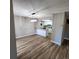 Spacious living room open to the kitchen, features wood-look floors, and natural light at 2746 S Kenton Ct, Aurora, CO 80014
