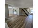 Open-concept living area with modern flooring and staircase at 2746 S Kenton Ct, Aurora, CO 80014