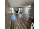 Spacious living room features wood-look floors, fireplace, and large windows, perfect for relaxing and gatherings at 2746 S Kenton Ct, Aurora, CO 80014